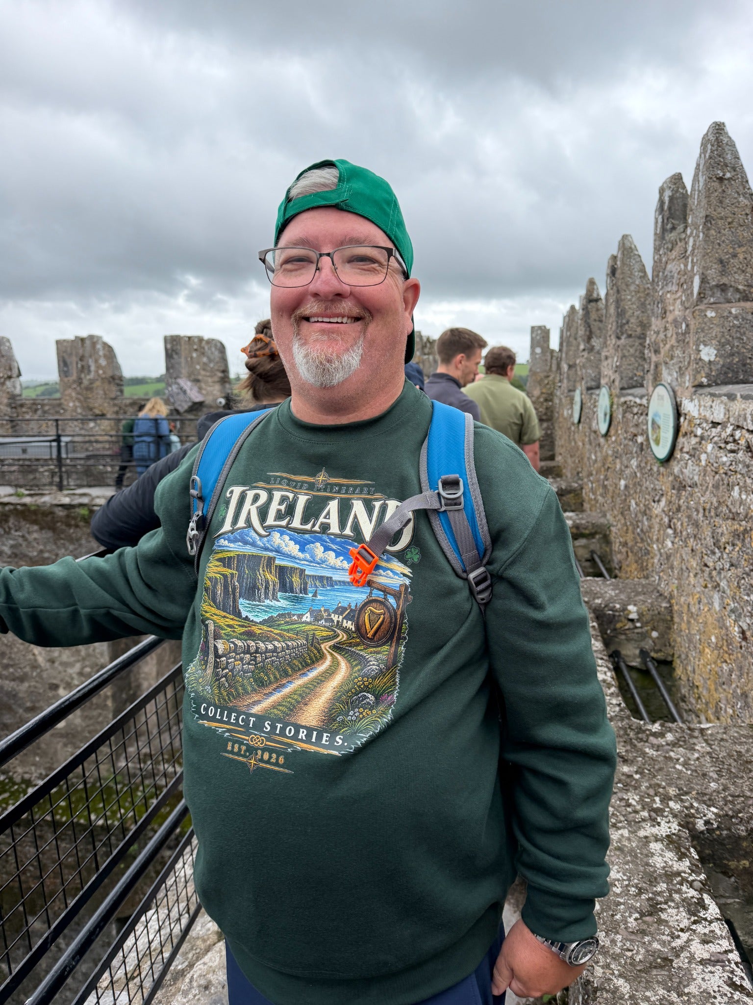 Rusty wearing the green Ireland sweatshirt on the castle battlements.