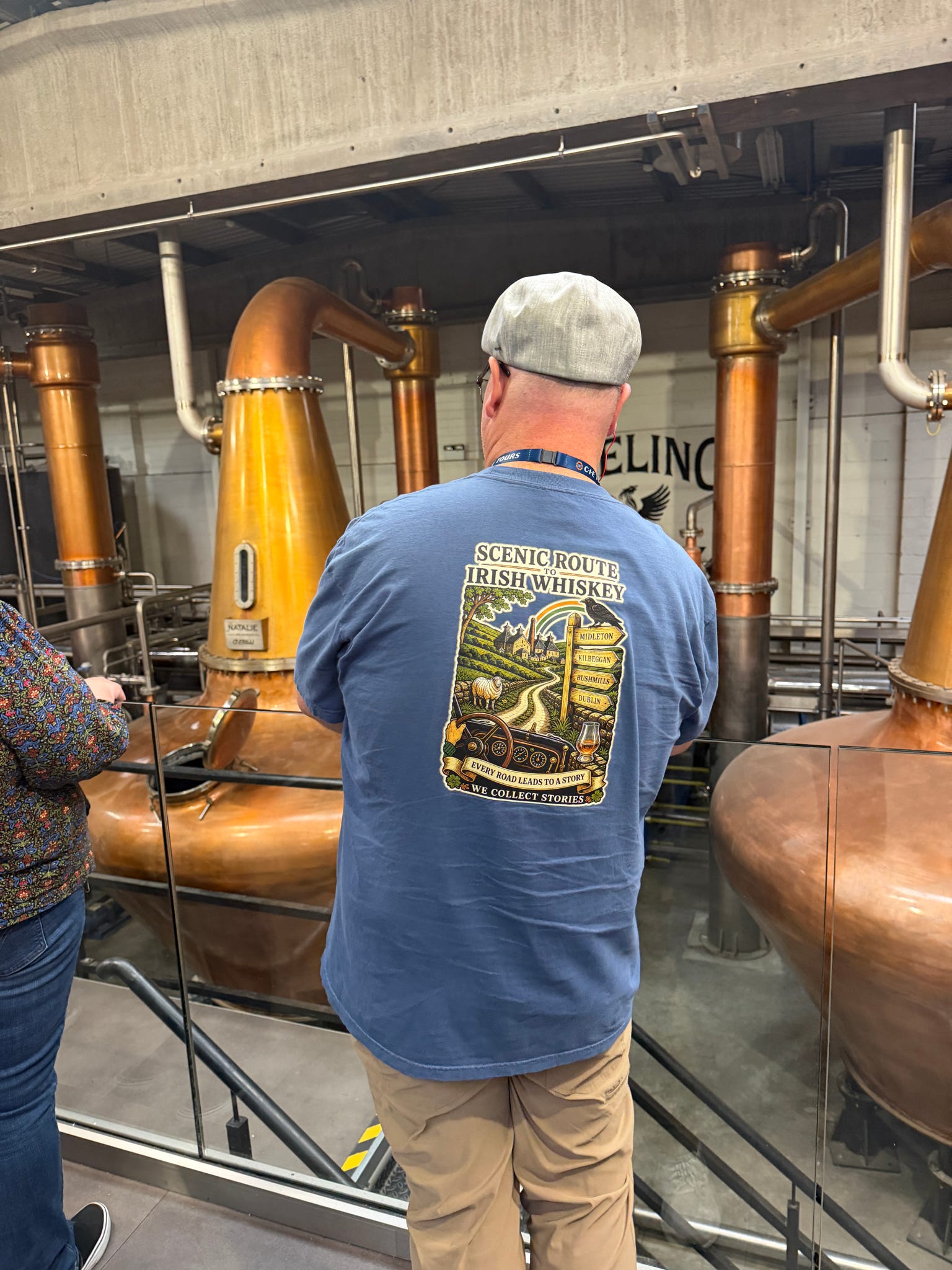 Scenic Route to Irish Whiskey shirt worn at Teeling Distillery beside the copper stills.